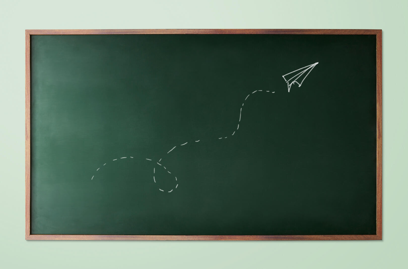 Chalkboard with plane going up